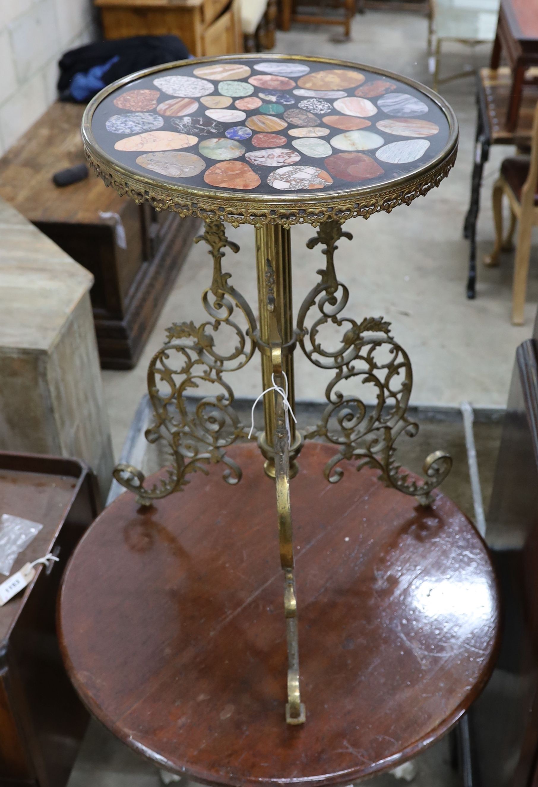 A circular brass and specimen marble tripod table, top diameter 40cm, height 71cm